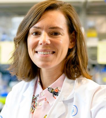 A scientist at MSK stands in a research lab, representing how donor support funds breakthrough discoveries and advances in cancer treatment. 