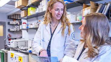 Two MSK researchers working in a lab.